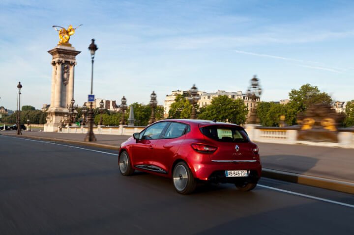 2012 Red Renault Clio driving in Paris