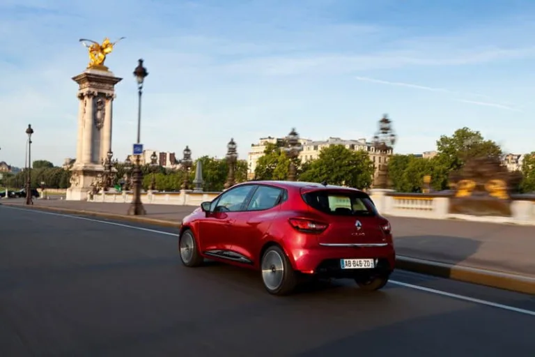 2012 Red Renault Clio driving in Paris